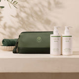 A shower gel and lotion in a great green toiletry bag